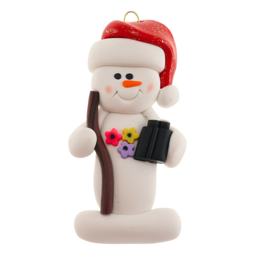 Snowman in red hat holding walking stick and binoculars.
