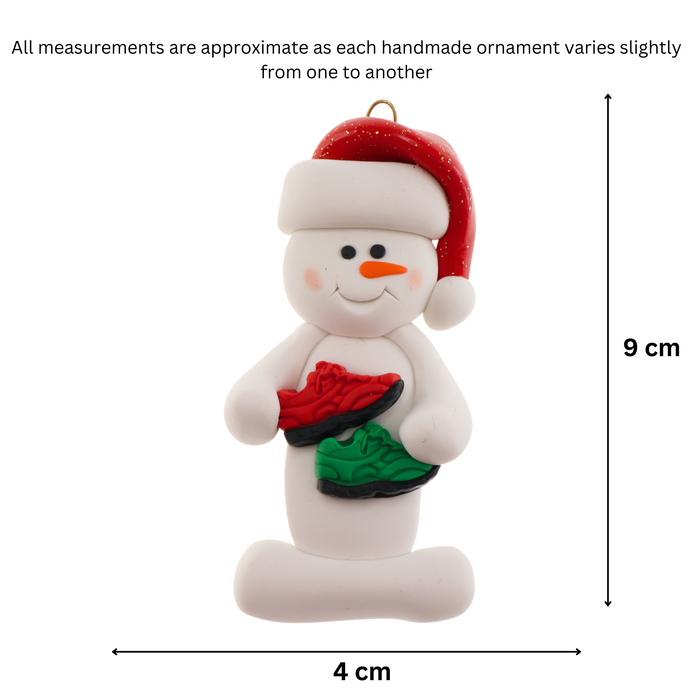 Snowman in red hat with running shoes, graphed to show size (4x9cm).