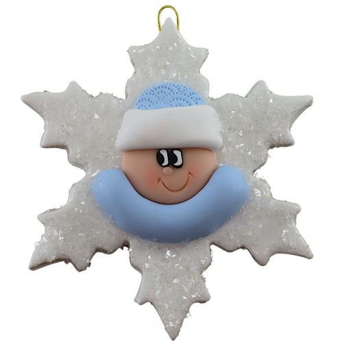 Baby ornament with infant face and blue hat on glittery white snowflake base.