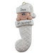 Ornament with infant head in a white glitter hat poking out of a white glitter stocking, personalized with name.