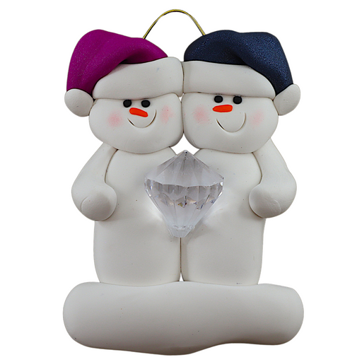 A couple’s ornament of two white snowmen holding a plastic diamond.