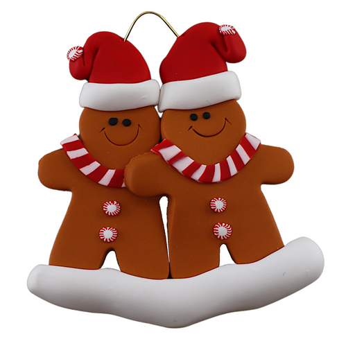 Family ornament with 2 brown gingerbread figures in red Christmas hats.