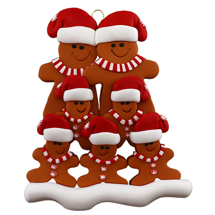 Family ornament with 7 brown gingerbread figures in red Christmas hats.