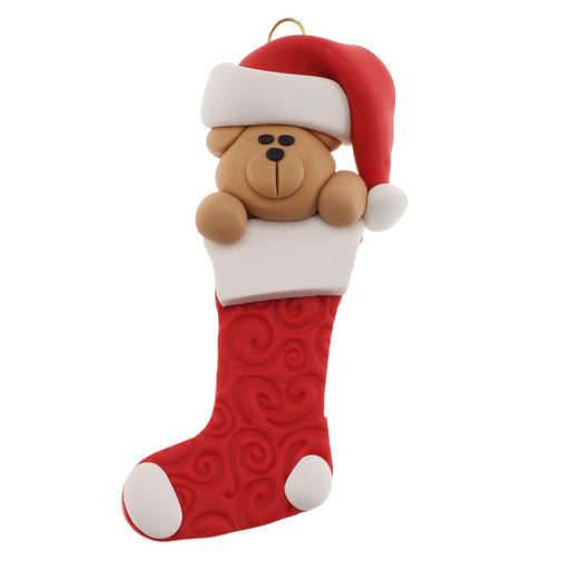 Ornament of bear head poking out of a red stocking.