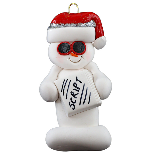 Ornament of white snowman in red hat and sunglasses holding a movie script.