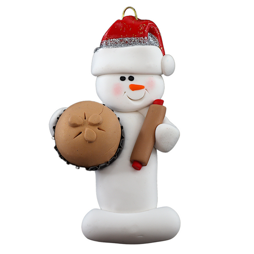 Ornament of white snowman in red hat holding a baked pie and rolling pin.