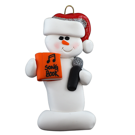 Ornament of white snowman in red hat holding a microphone and orange music book.