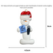 Ornament of white snowman in red hat holding a microphone and blue music book, graphed to show size (4.5x9cm).