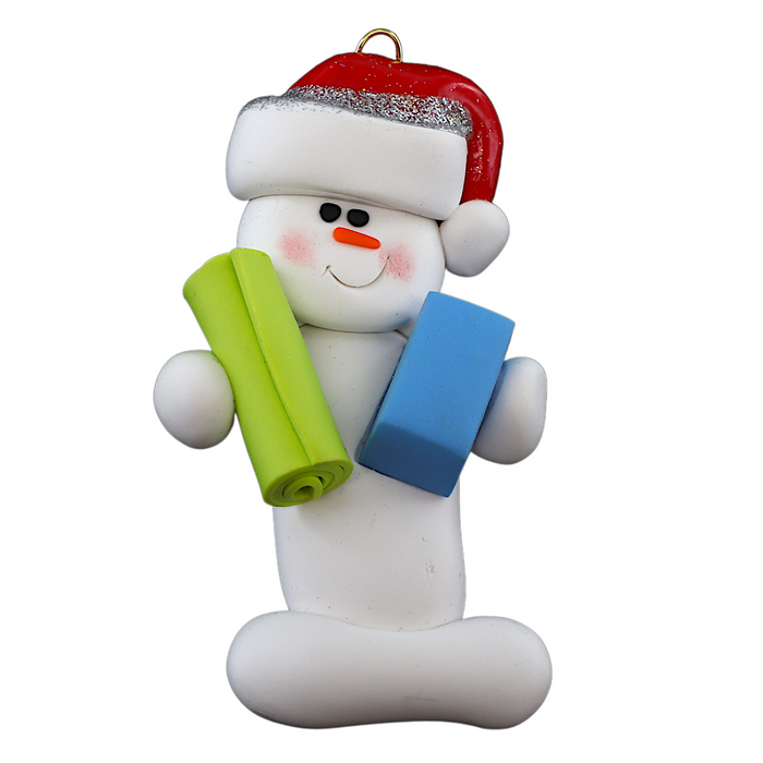 Ornament of white snowman in red hat holding vibrant yoga mat and block.