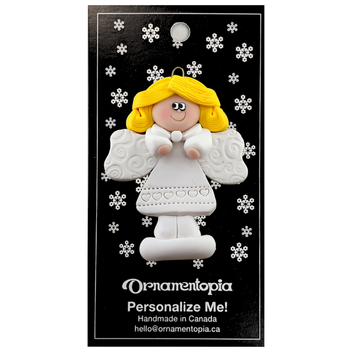 Angel wearing white with blonde hair ornament, on display backing card.