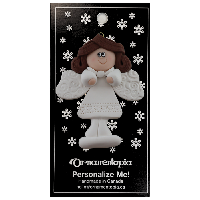 Angel wearing white with brown hair ornament, on display backing card.