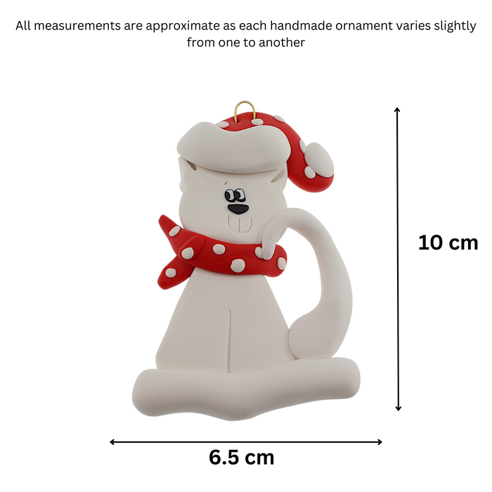 Ornament of white cat in red and white polka dot Christmas hat and scarf, graphed to show size (6.5x10cm).