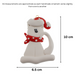 Ornament of white cat in red and white polka dot Christmas hat and scarf, graphed to show size (6.5x10cm).