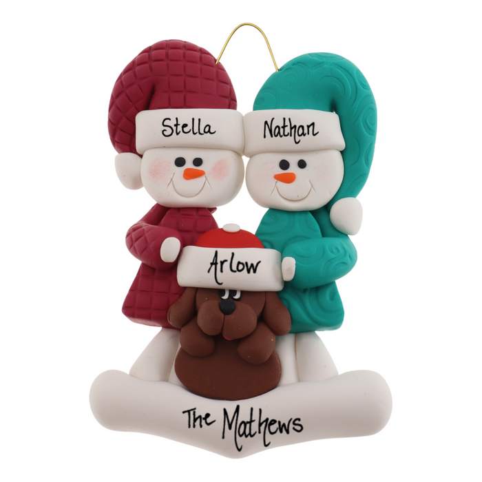 Ornament of snowman couple in red and green shirts and hats with brown dog in Christmas hat, personalized with names.