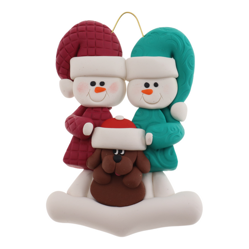 Ornament of snowman couple in red and green shirts and hats with brown dog in Christmas hat.