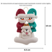 Ornament of snowman couple in red and green shirts and hats with white dog in Christmas hat, graphed to show size (6.5x10cm).