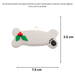 Ornament of dog bone with holly and paw print, graphed to show size (7.5x3.5cm).