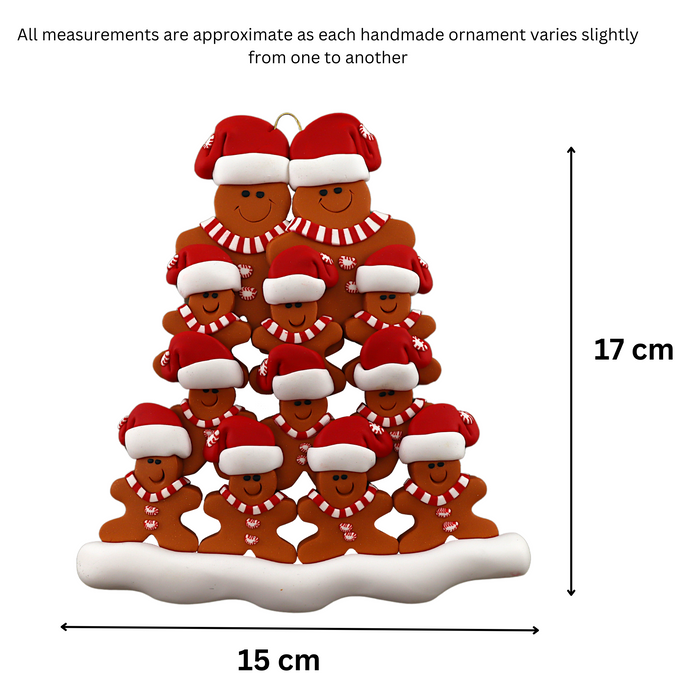 Family ornament with 12 brown gingerbread figures in red Christmas hats, graphed to show size (15x17cm).