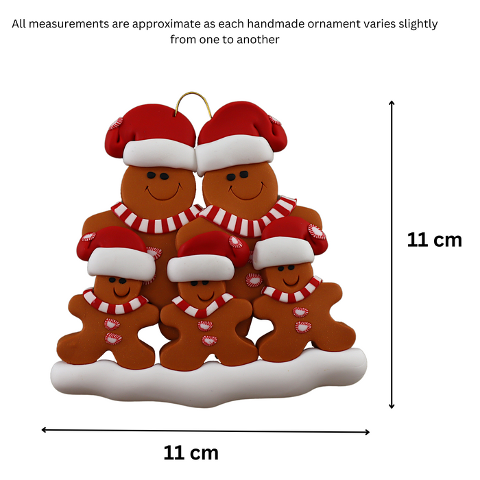 Family ornament with 5 brown gingerbread figures in red Christmas hats, graphed to show size (11x11cm).