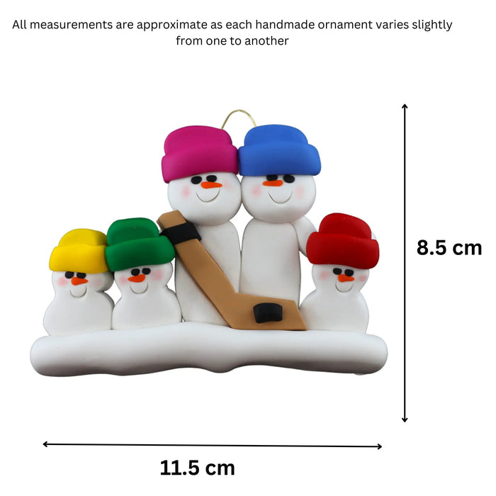 Family ornament with 5 white snowmen in bright hats, holding a hockey stick, graphed to show size (11.5x8.5cm).