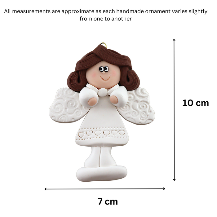 Angel wearing white with brown hair ornament, graphed to show size (7x10cm).