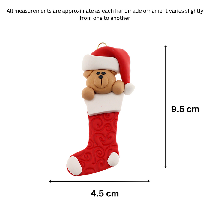 Ornament of bear head poking out of a red stocking, graphed to show size (4.5x9.5cm).