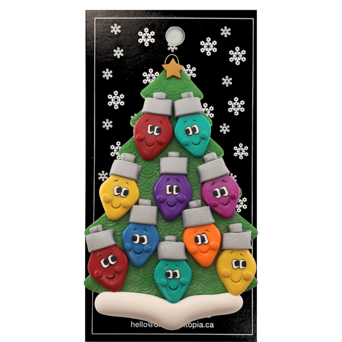 Christmas tree ornament decorated with 10 light bulbs with smiling faces, on display backing card.
