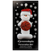 Ornament of white snowman in red hat holding a basketball, on display backing card.