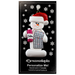 Ornament of white snowman in red hat holding a bingo card and dabber, on display backing card.