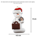 Ornament of white snowman in red hat holding a briefcase and paper bills, graphed to show size (4.5x9cm).