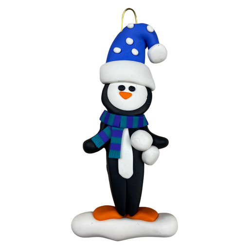 Penguin wearing blue hat and scarf ornament.
