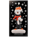 Penguin wearing orange hat and scarf ornament, on display backing card.