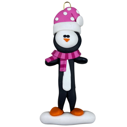 Penguin wearing pink hat and scarf ornament.