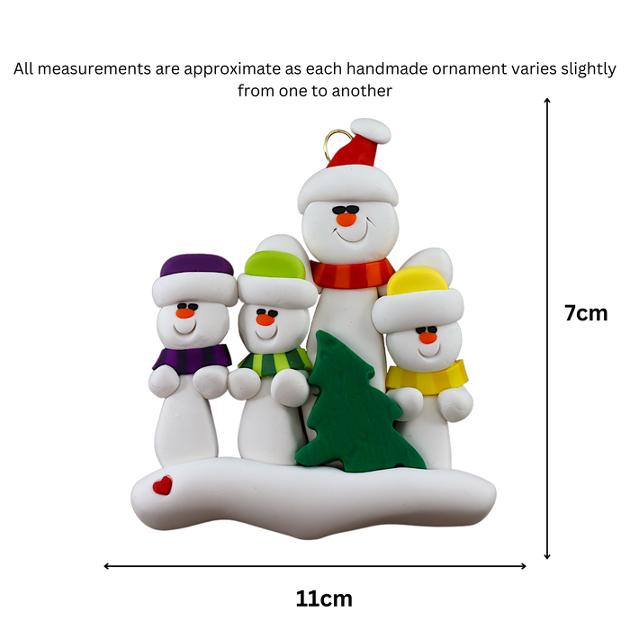 Family ornament with 1 large and 3 small white snowmen in bright scarves, with green Christmas tree, graphed to show size (11x7cm).