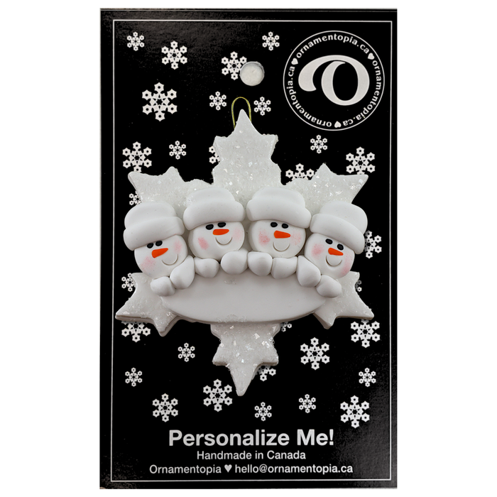 Family ornament with 4 white snowmen stacked on top of a glitter white snowflake, on display backing card.