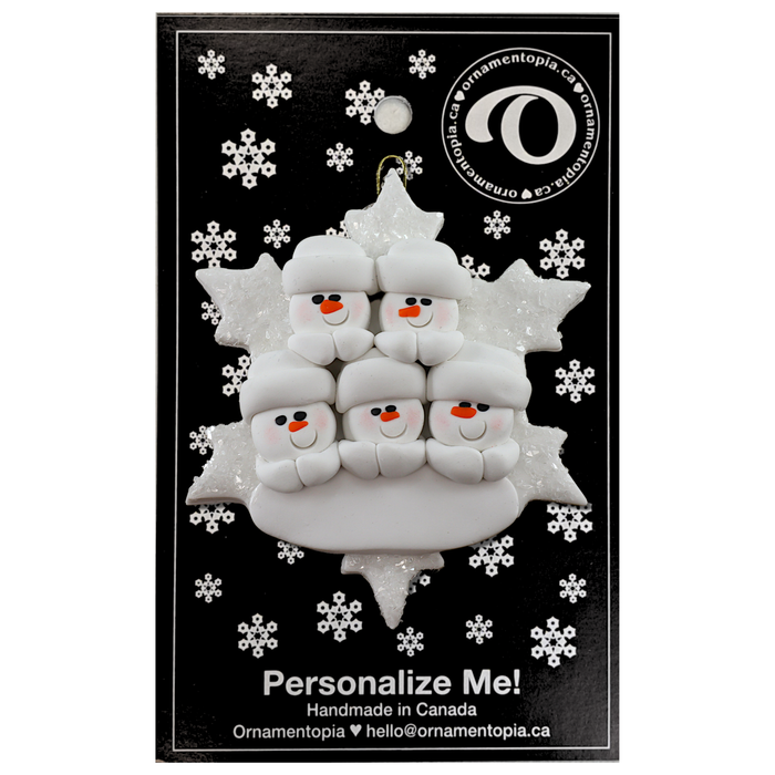 Family ornament with 5 white snowmen stacked on top of a glitter white snowflake, on display backing card.