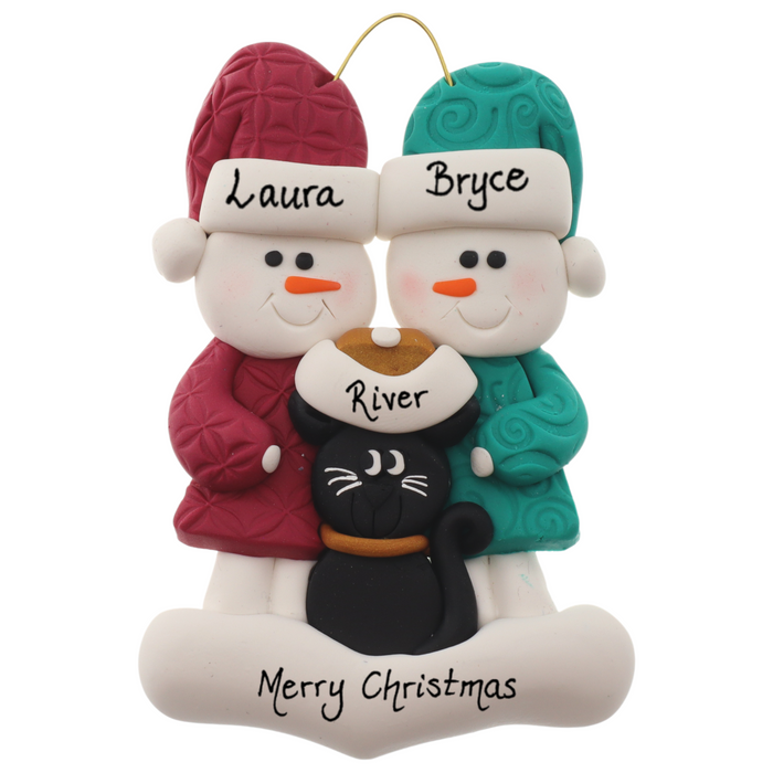 Ornament of snowman couple in red and green shirts and hats with a black cat in Christmas hat, personalized with names.