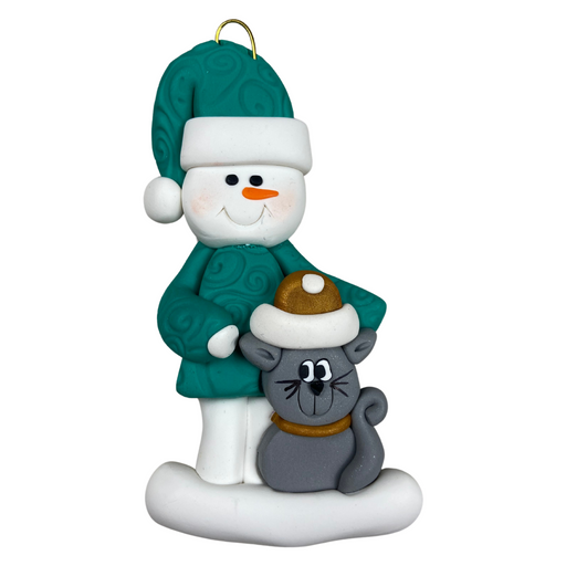 Ornament of snowman in a green shirt and hat with grey cat in Christmas hat.