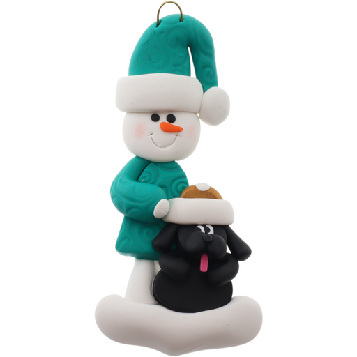 Ornament of snowman in green shirt and hat with black dog in Christmas hat.