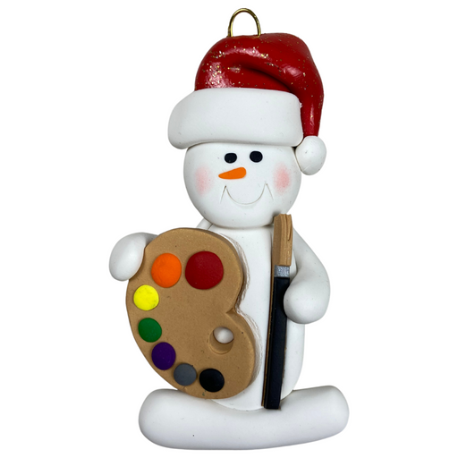 Ornament of white snowman in red hat holding a paint palette and paintbrush.