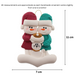 Ornament of snowman couple in red and green shirts and hats with a white cat in Christmas hat, graphed to show size (7x11cm).