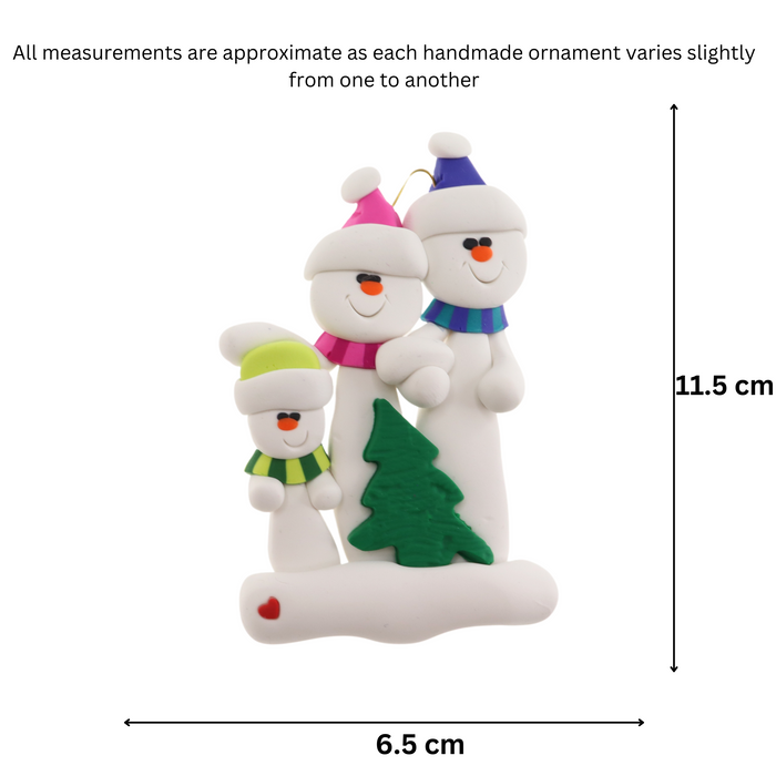 Family ornament with 3 white snowmen in bright scarves, with green Christmas tree, graphed to show size (6.5x11.5cm).