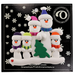 Family ornament with 5 white snowmen in bright scarves, with green Christmas tree, on display card backing.